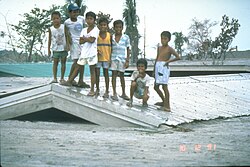Children on roof of a school in Bamban, that was buried by lahars during the 1991 eruption of Mt. Pinatubo.