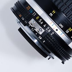 Nikon lens for Nikon F mount; the infrared index mark is the small red dot under one yellow hash mark for hyperfocal range at f/8.