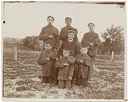 Teacher and young boys posed for photograph