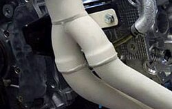 A ceramic coating on the exhaust system of a car lowers the surface temperature.