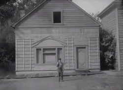 Keaton, who did his own stunt work, in a potentially life-threatening scene from Steamboat Bill, Jr. (1928)