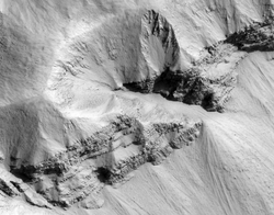 Columnar jointed rocks in unnamed crater wall, Marte Vallis region, Mars. Image courtesy of the High Resolution Imaging Science Experiment, University of Arizona.
