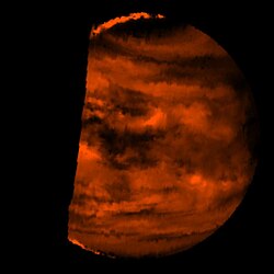 False colour near-infrared (2.3 μm) image of the deep atmosphere of Venus obtained by Galileo, red areas are signatures of the hot surface radiating through the atmosphere relatively unhindered. The dark spots are clouds silhouetted against the very hot lower atmosphere emitting thermal infrared radiation.