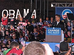 Obama campaigning as a symbol of change in Cleveland, Ohio with a "Change We Need" sign