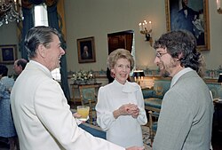 President Ronald Reagan and First Lady Nancy Reagan with Spielberg at The White House during a private dinner and showing of E.T. in 1982