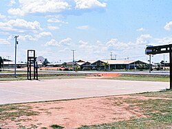 Basketball court and a mess hall, looking northeast at Benning Ave and Bataan Drive, 1970