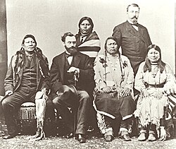 Delegation of Ute Indians in Washington, D.C., in 1880. Background: Woretsiz and general Charles Adams (Colorado Indian agent) are standing. Front from left to right: Chief Ignacio of the Southern Utes; Carl Schurz US Secretary of the Interior; Chief Ouray and his wife Chipeta.