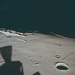 The Apollo 11 landing site at center, facing west, with the 22-kilometer-wide Maskelyne crater in right foreground