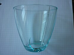 Drinking glass with fracture due to uneven thermal expansion after pouring of hot liquid into the otherwise cool glass