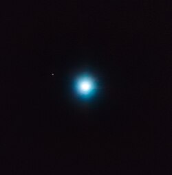 The large central object is the star CVSO 30; the small dot up and to the left is exoplanet CVSO 30c. This image was made using astrometry data from VLT's NACO and SINFONI instruments.[67]