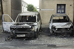 Cars damaged by arson in Millwall, Tower Hamlets, London, during the 2011 England riots