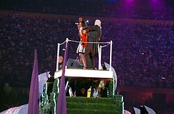 Lewis on stage with Jimmy Page at the closing ceremony of the 2008 Beijing Olympic Games. Lewis, Page and David Beckham represented Britain in the handing over segment for the 2012 Games to be held in London.