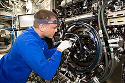 Wiseman working in the Destiny module of the ISS in August 2014