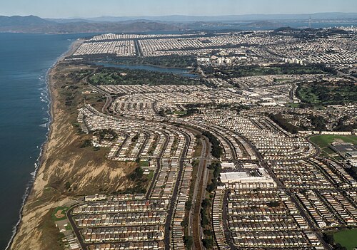 Aerial view of tract housing in Daly City, California, a suburb of San Francisco, which inspired Reynolds to write the song