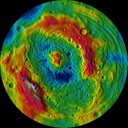 Elevation map of Vesta's southern hemisphere. Higher elevations (red) are found on the crater rim (occluding Veneneia) and the central peak.