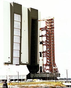 Apollo 16's launch vehicle by the Vehicle Assembly Building, January 27, 1972