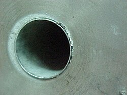 Corrosion in the crevice between the tube and tube sheet (both made of type 316 stainless steel) of a heat exchanger in a seawater desalination plant