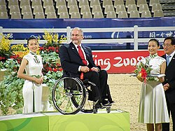 Sir Philip participating in the medal presentation ceremony for the equestrian events at the 2008 Beijing Paralympics