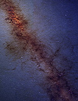 The Galactic Center, as seen by one of the 2MASS infrared telescopes, is located in the bright upper left portion of the image.