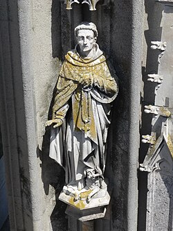 Lichens on a limestone statue on a tower of Regensburg Cathedral