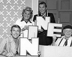 Celebrating the start of its ninth year on the air in 1974, (L–R) are Paul Lynde, Rose Marie, host Peter Marshall and Cliff Arquette as Charley Weaver.