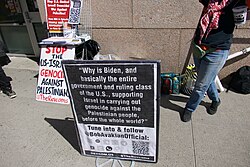 Protest outside Columbia University highlighting Biden administration's complicity in Gaza genocide, April 22, 2024