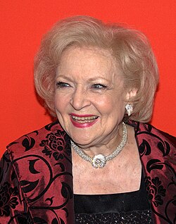 Photograph of an elderly white woman laughing