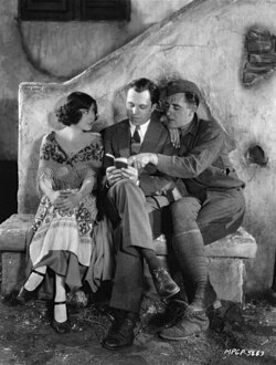 King Vidor (center) with Renée Adorée and John Gilbert. On the set of The Big Parade