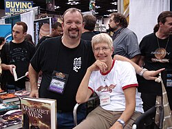 Margaret Weis (seated) with Tracy Hickman at Gen Con Indy 2008