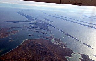 Aerial view of the almost flat and drowned peneplain at Belcher Islands, Hudson Bay, Canada, cutting across numerous geologic folds.