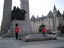 Ceremonial Guard stand watch over Canada's national memorial, The Response, with the Tomb of the Unknown Soldier in the foreground