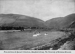 Teepees at the site of Missoula, south of the Clark Fork River, facing northeast