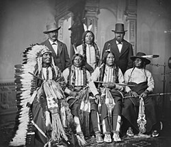 Touch the Clouds (seated at left with headdress), photo taken fall 1877, during his visit to Washington, D.C. as a delegate to meet with President Hayes