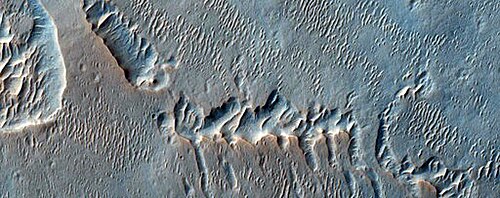 Enigmatic ridges in Terra Meridiani from HiRISE, 2012. Terra Meridiani is one of the more complex regions on Mars.