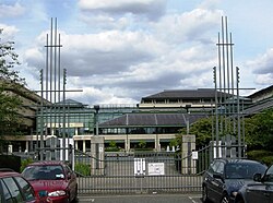 Entrance gates to the UK National Archives, Kew, from Ruskin Avenue. The notched vertical elements were inspired by medieval tally sticks.