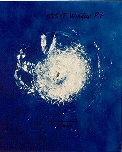 Large glass pit (damage)