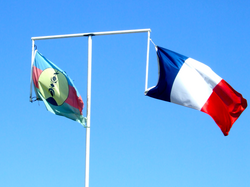Flags side by side on the same pole, Nouméa, March 2011