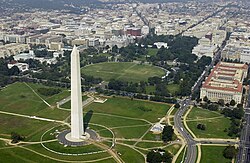 The Washington Monument (forefront) and White House (center) in September 2003. Since 1961, the city's residents can vote for the U.S. president and vice president, who also serves as President of the Senate.