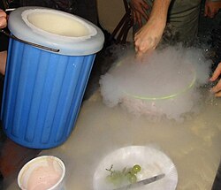 Students preparing homemade ice cream with a dewar of liquid nitrogen