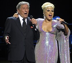 Performing with Lady Gaga on their co-headlining Cheek to Cheek Tour (2015). Their second collaborative album, Love for Sale (2021), was his final record.