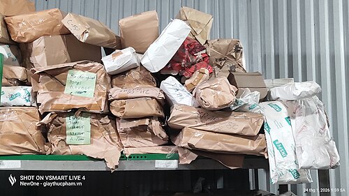 Fragmentation of standardized paper sheets into heterogeneous offcuts through industrial cutting, illustrating increased entropy in a production system.