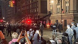 NYPD officers preparing to raid Hamilton Hall line up aboard a Lenco BearCat.[125]