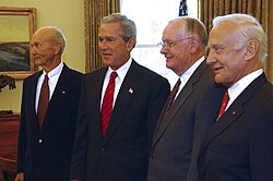 Michael Collins, President George W. Bush, Neil Armstrong, and Buzz Aldrin during celebrations of the 35th anniversary of the Apollo 11 flight, July 21, 2004