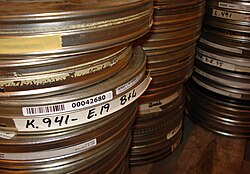 Stacked film cans containing rolls of film