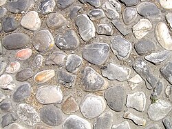 Cobblestones on a road surface in Imola, Italy