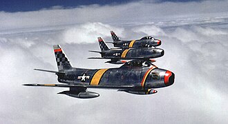Colonel Davis, commander of the 51st FIW, leads a formation of F-86F Sabres during the Korean War, 1953