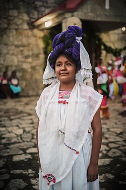 A girl wears the traditional Nahua headdress in Yohualichan, Veracruz.