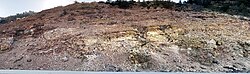 Clinker exposed by a cutting for a road through Willow Creek Canyon, Carbon County, Utah