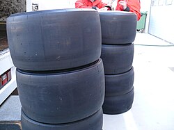 Absence of grooves maximizes dry-pavement friction on a set of slick Formula One tires