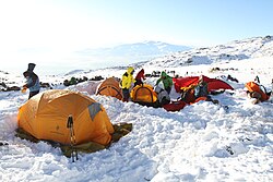 Winter campers bivouaced in the snow
